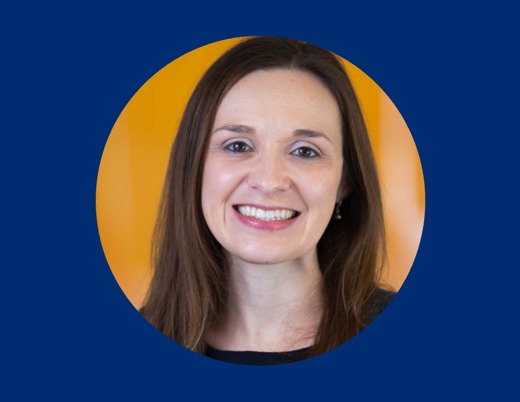 Professional headshot of Alyssa Schlenz, PhD, centered in a circular crop, with a solid dark blue background.