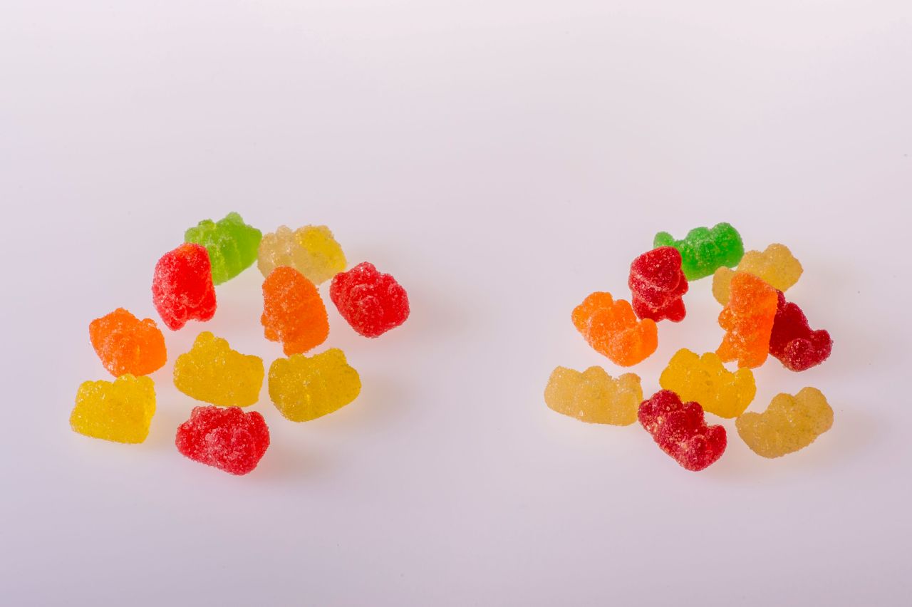 Two piles of colorful gummy candies that resemble common edible products containing THC.