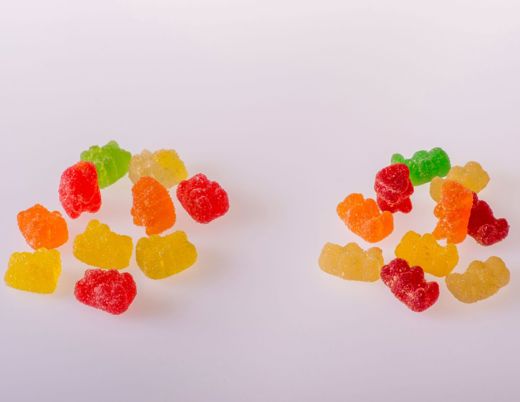 Two piles of colorful gummy candies that resemble common edible products containing THC.
