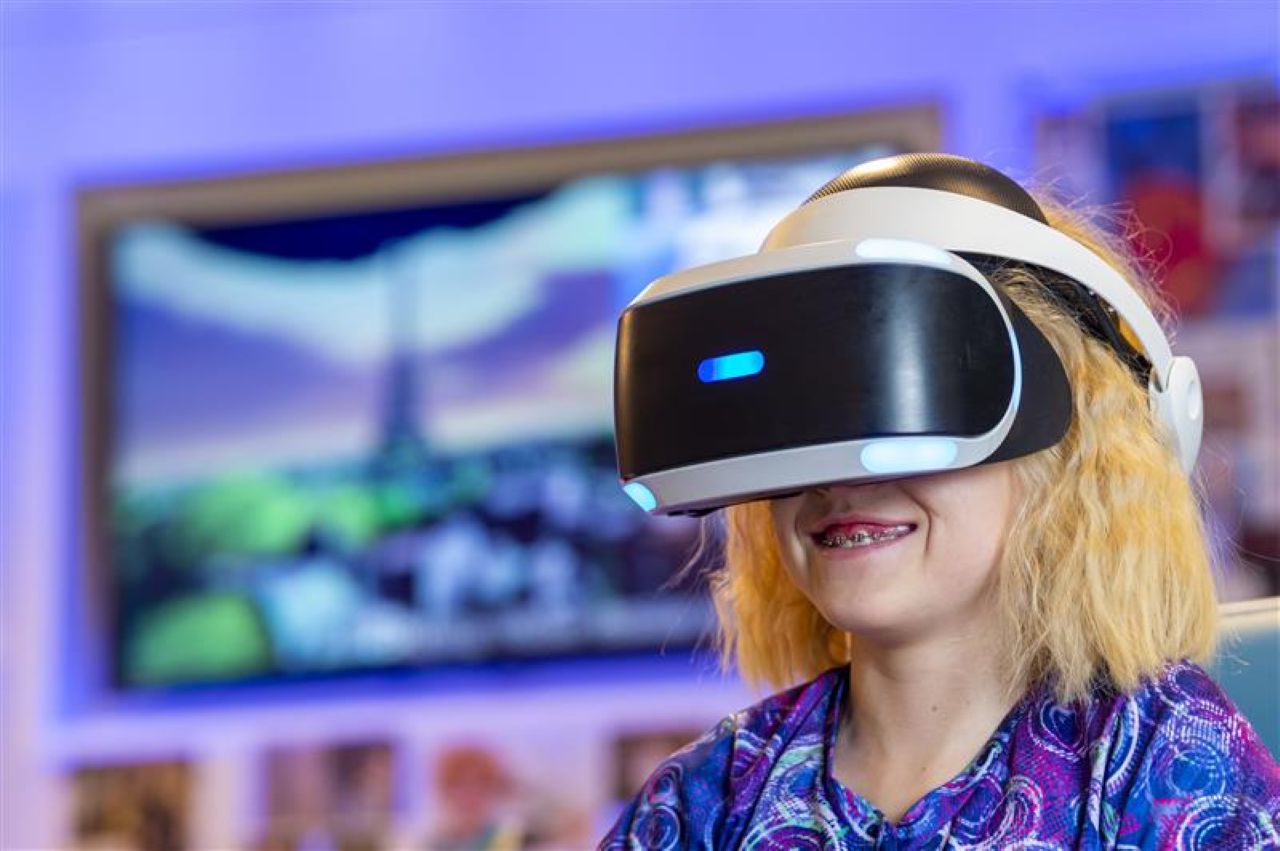 Girl wears virtual reality headset 