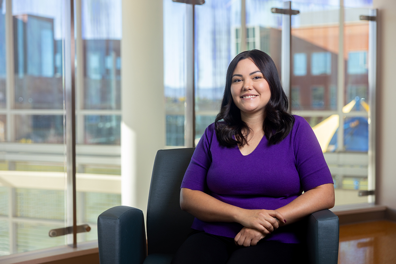 Sonja Garcia, Health Navigator sitting in a chair 