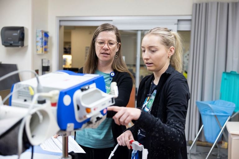 People looking at medical equipment 