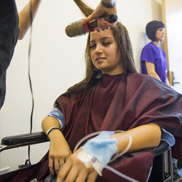Two teen girls talk to each other