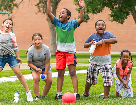 Five kids playing in a park