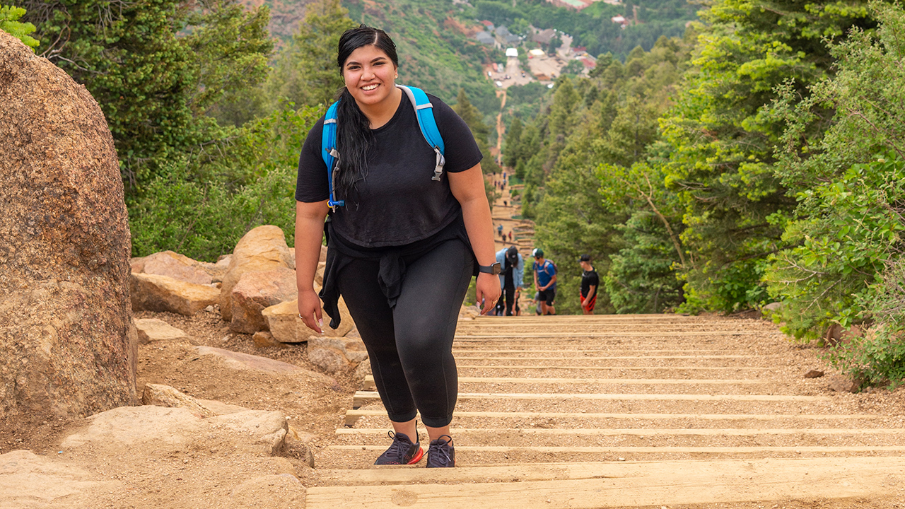 A girl climbing stairs after bariatric surgery