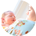 A new mom holds her baby