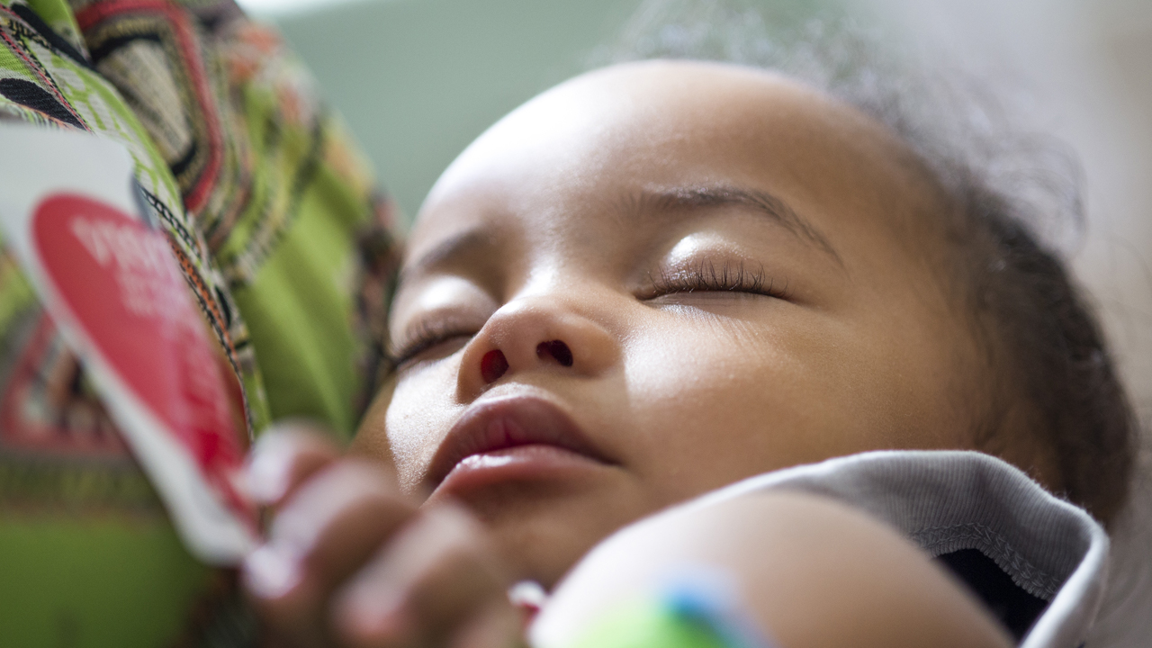 A close up of a kid sleeping