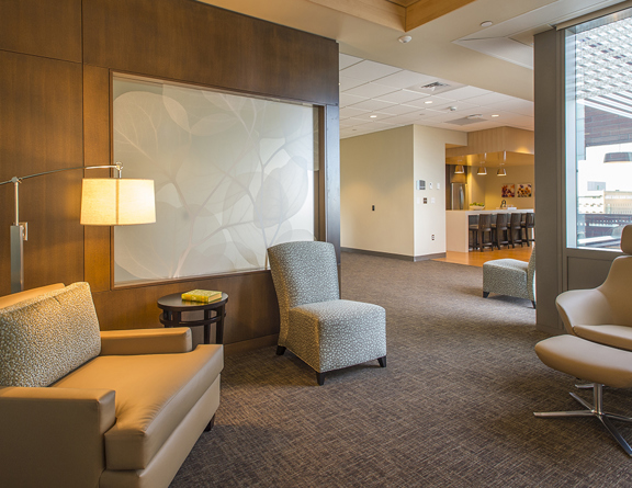 Room with multiple chairs and soft lighting