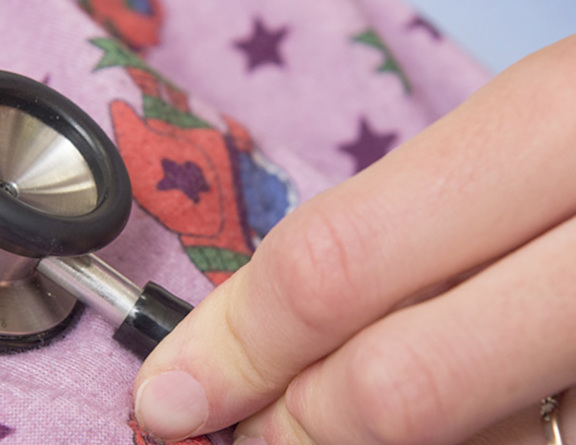 A close-up of a stethoscope on a patient's chest.