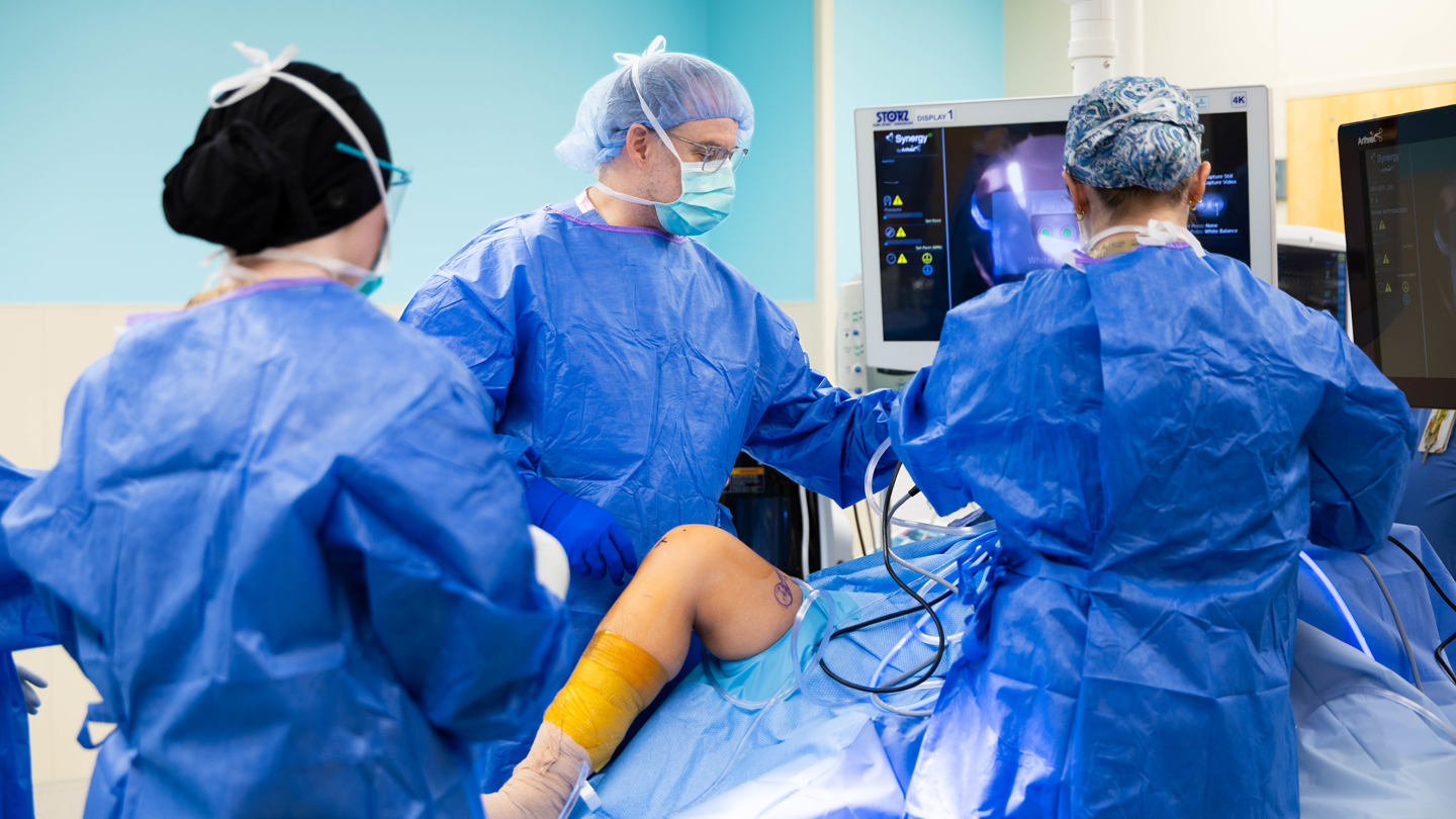 Surgeons performing surgery on a leg 