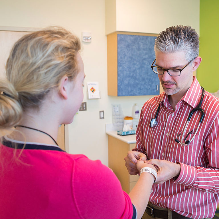 Dr. Brian Shirley treating a rheumatology patient