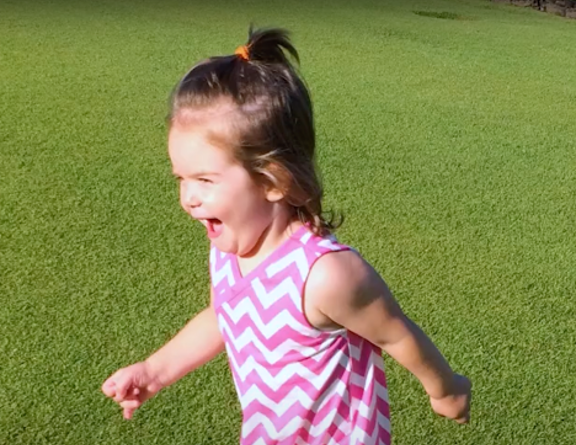 Beckett running in a feild smiling