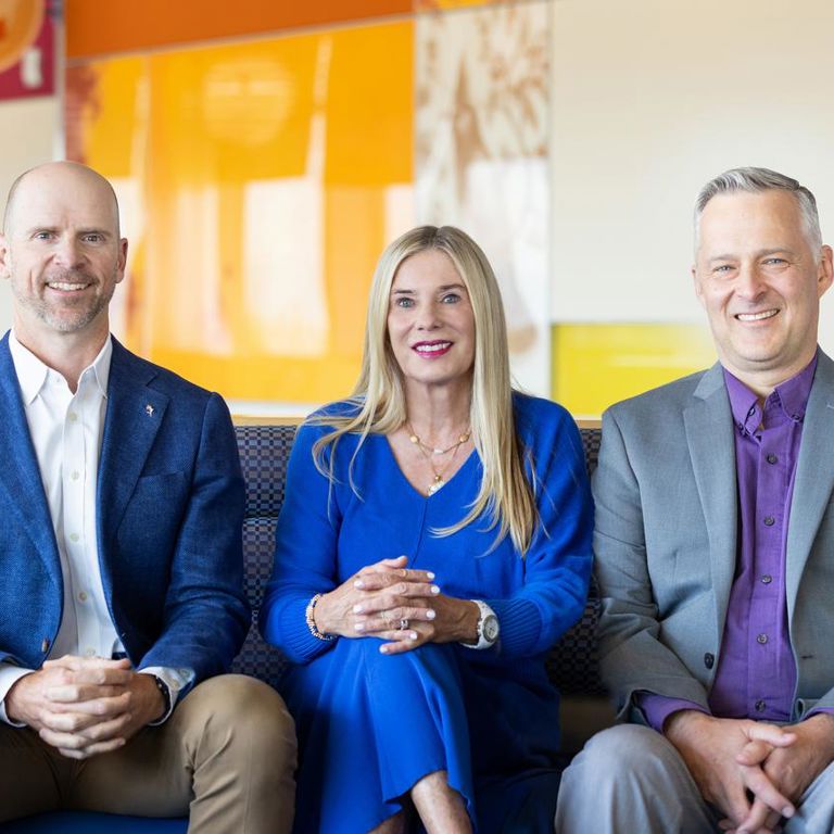 Charting Pediatrics hosts David Brumbaugh, MD, Alison Brent, MD and Dan Nicklas, MD sit together in a Children's Hospital Colorado waiting room.