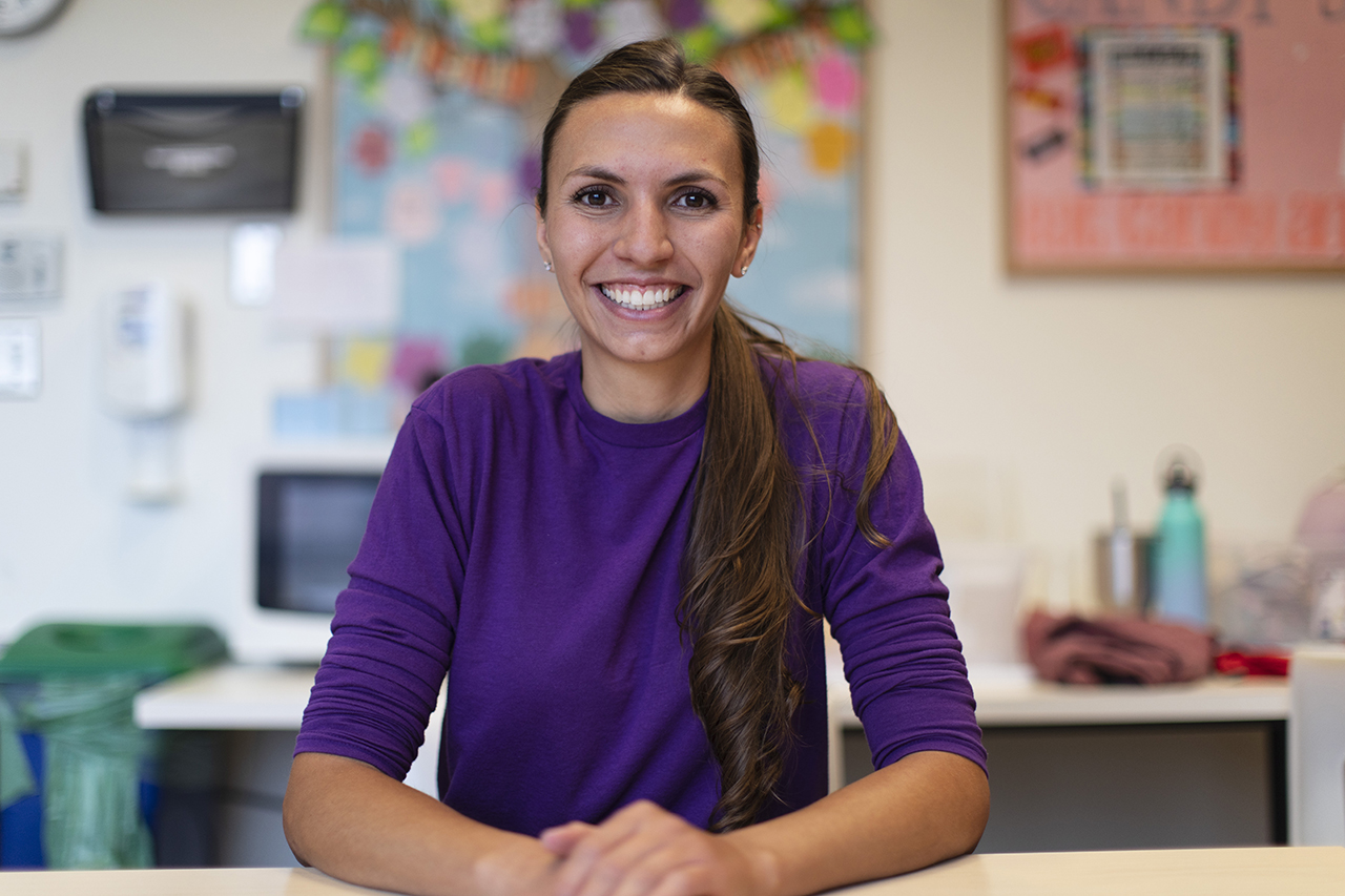Maddie Vigil, a NICU nurse, monitoring and caring for an infant in an incubator.