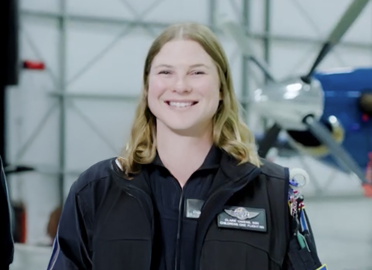 Claire Owens, flight nurse, standing in front of the Children’s One medical transport helicopter.
