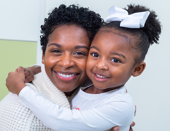 Mother and Daughter smiling