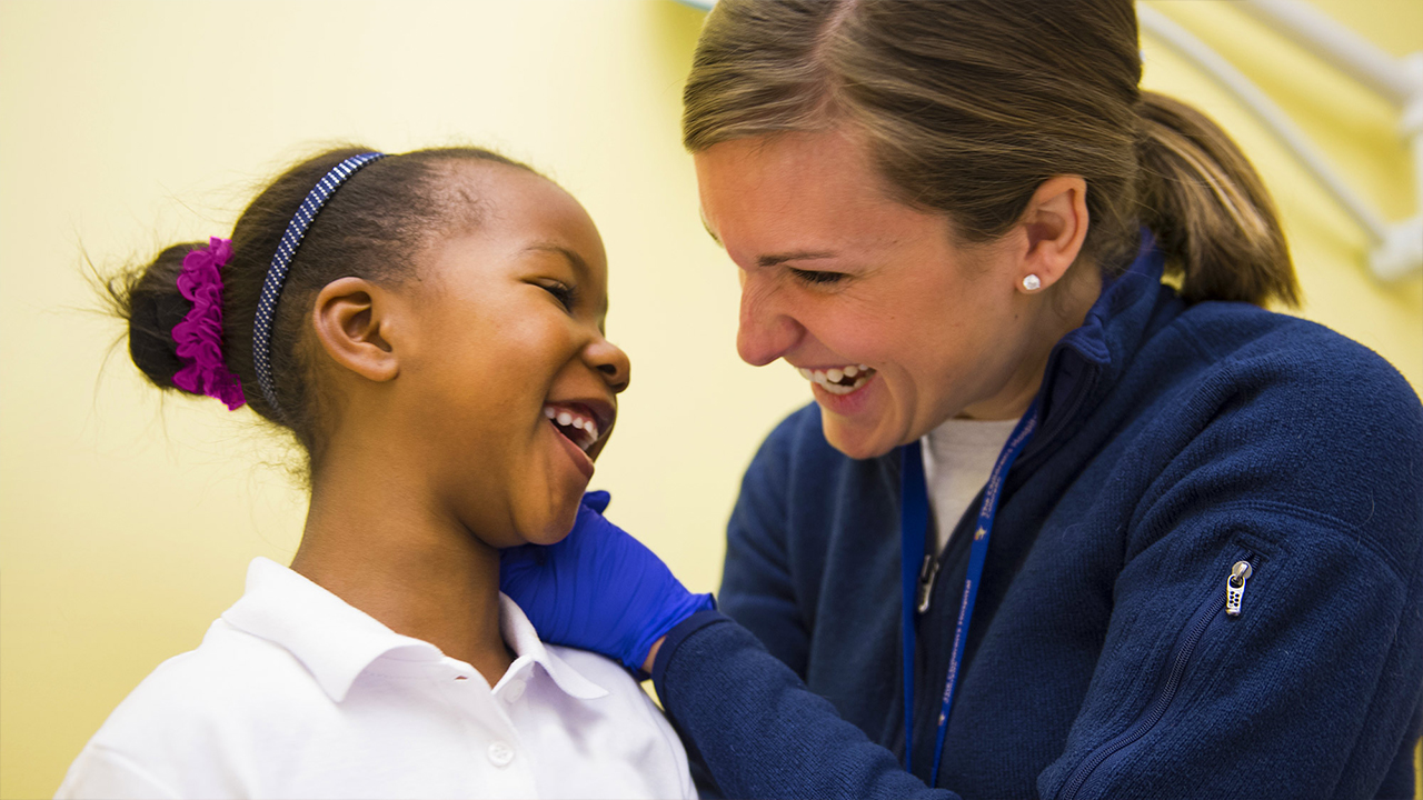 Doctor at Children’s Colorado with patient in exam room