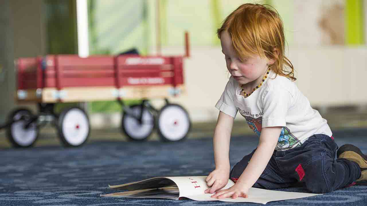 child practices reading