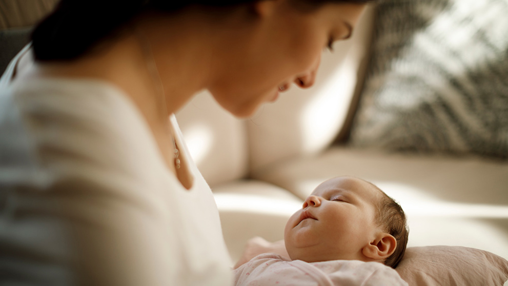 Mother tending to her baby