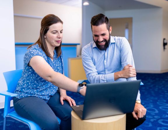 Julie Wilson and David Howell (clinicians) looking at a computer screen