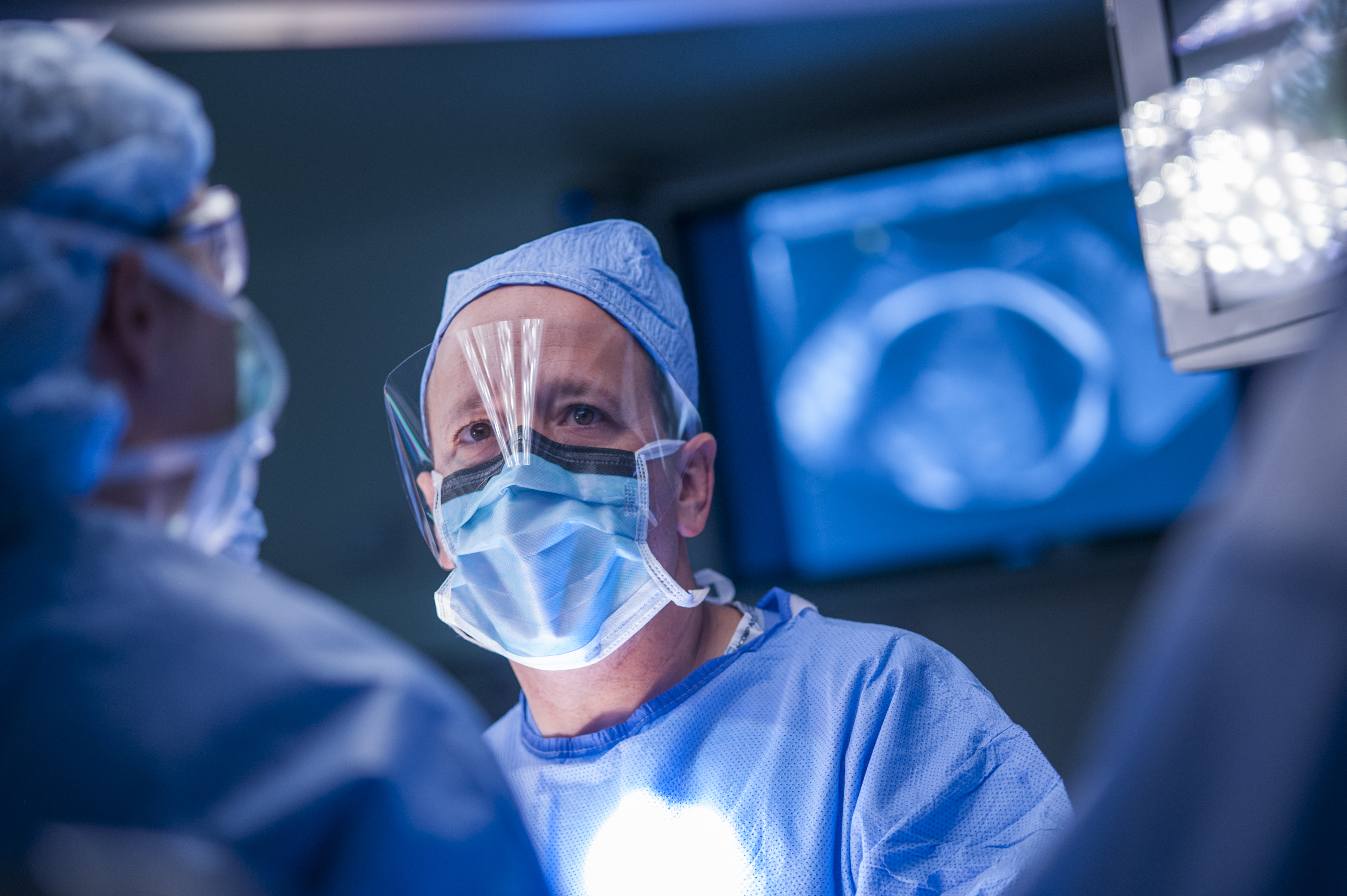 Surgeons perform an operation.