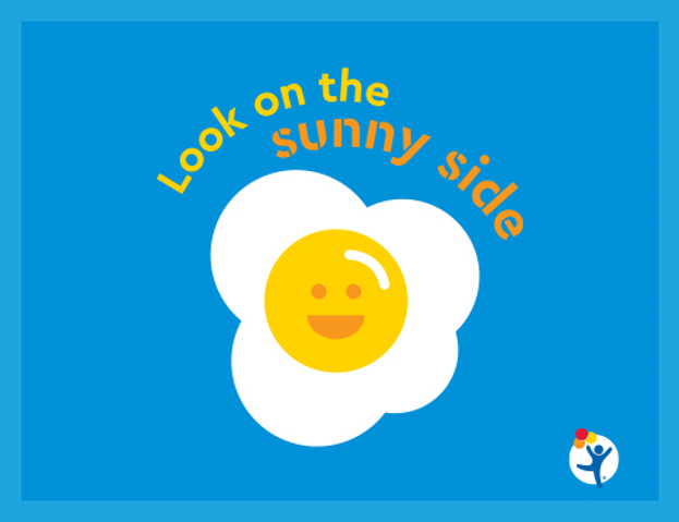 Colorful cartoon graphic of a smiling egg with text that reads "Look on the sunny side" 
